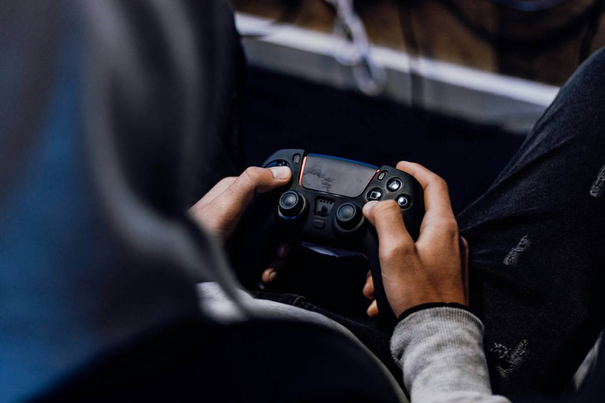 Close-up of game controller nintendo switch action buttons showing wear patterns from intense use