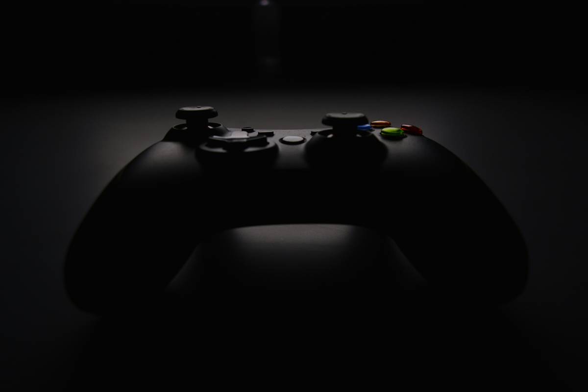 Deltaco gaming nintendo switch controller held in hands showing button layout and ergonomic design