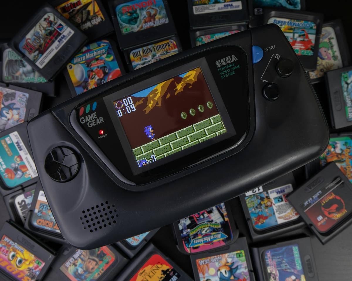 new nintendo switch controllers displayed on a gaming desk with docked Switch console