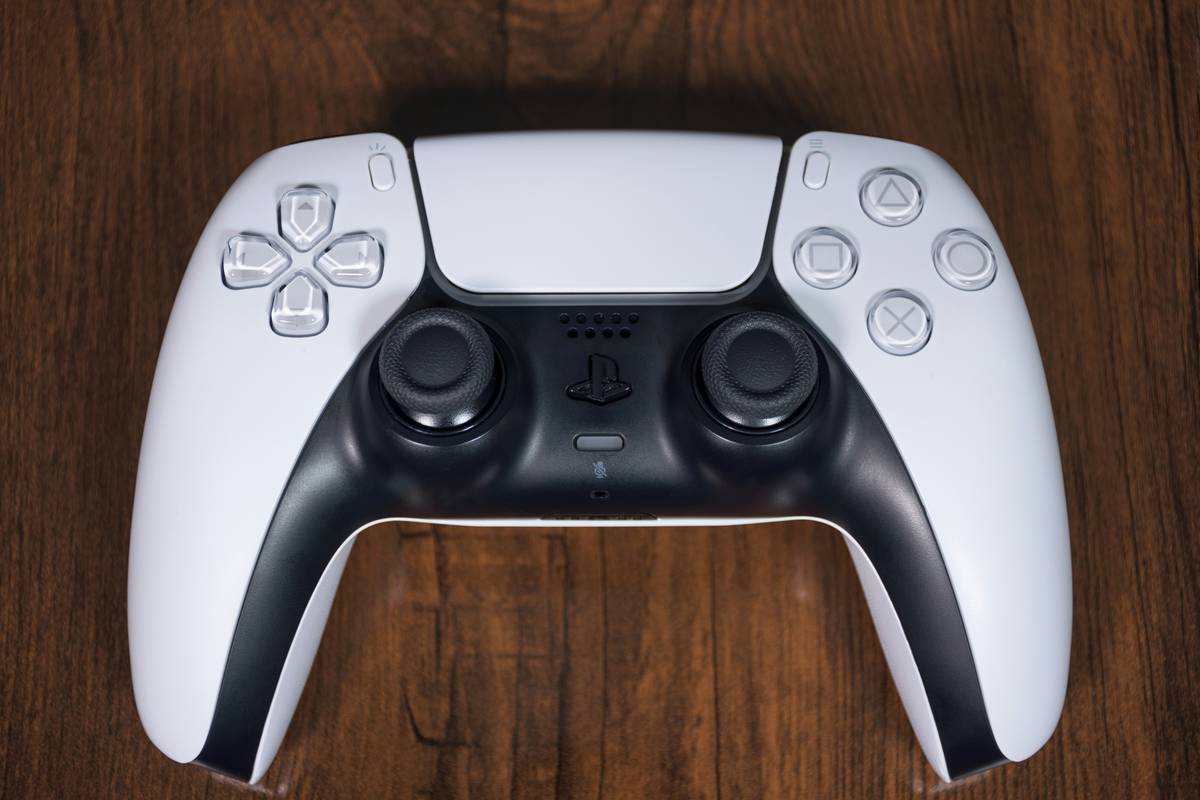 nintendo switch controller online — official Nintendo Pro Controller beside third-party alternatives on a gaming desk